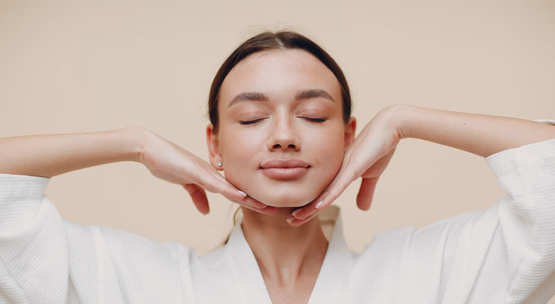A woman looking relaxed and refreshed after a facial