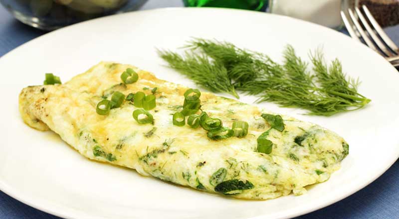 An egg white omelet made with spinach and scallions
