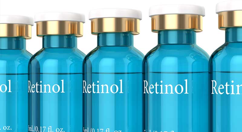 A line of five blue bottles marked Retinol