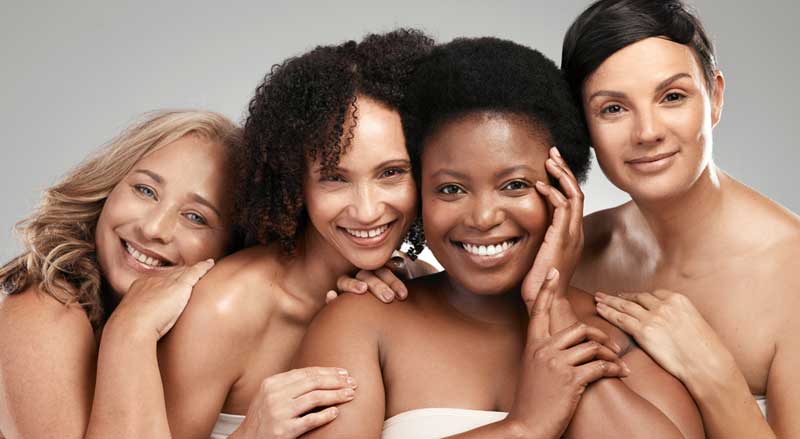 Four women with attractive, healthy looking skin